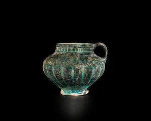 A globular black and turquoise blue glazed pottery pouring vessel,&nbsp;Ilkhanid central Iran,...