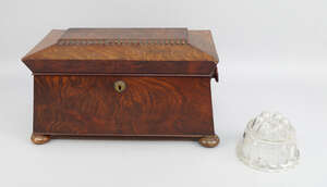 
	
		A William IV mahogany sarcophagus tea caddy, with turned handles, on bun feet, the...