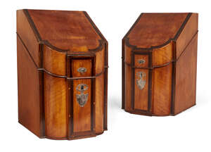 
	
		A pair of George III satinwood slope and serpentine front knife boxes, the silver handles...