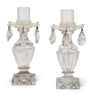 
	
		A pair of Regency Irish lustre drop urn shape candlesticks, the fluted sides raised on...