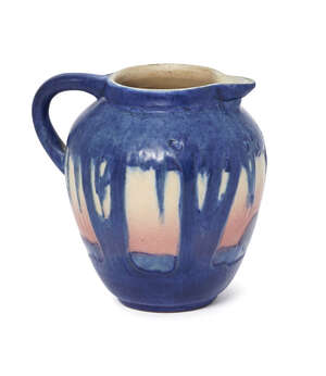 
	
		Newcomb College Pottery (USA), a small ceramic 'Oak and Moss' pattern jug
		First half...