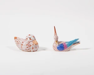 A Herend porcelain red 'fish scale' (VH) pattern bird and a Chinese red fish scale pattern duck, 20th century, the bird with blue printed marks, the duck with 