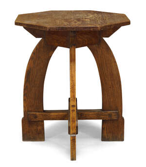 
	
		Arts & Crafts, an oak side table  
		Late 19th Century  
		The octagonal top on curved...