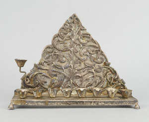 
	
		A silver Hannukah lamp struck only on one foot with an 84 with crude eagle displayed and...