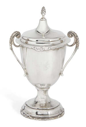 A silver three-handled cup with cover, Birmingham, c.1926, S. Blanckensee & Sons Ltd., the cup with decorative edge raised on a stepped circular foot, the bifu