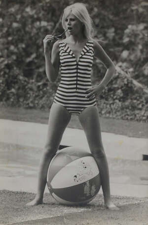 
	
		Terry O Neil, British, b. 1938, Britt Ekland in a striped swimsuit, black and white...