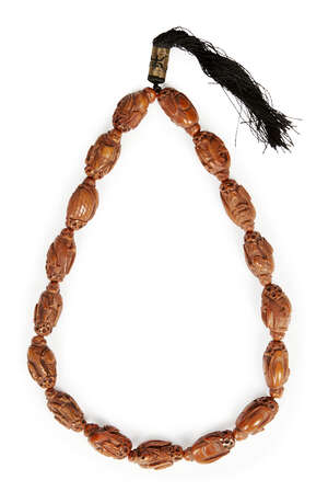 
	
		A Chinese hediau fruit nut bead necklace, early 20th century, each bead carved as a monk...