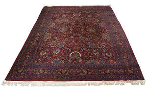 
	
		An Isfahan design carpet, mid/late 20th century, with all over design in a wine coloured...