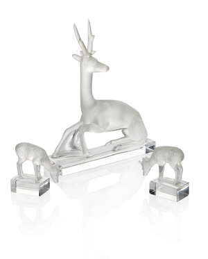 
	
		Lalique, a clear and frosted glass model of a seated Stag
		Modern, signed Lalique...