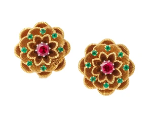 Cartier. A pair of 18ct gold ruby and emerald earclips, of floral design, set with a central...