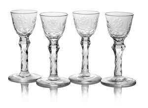 
	
		A set of four George III drinking glasses, c. 1775, each tapering bowl engraved with bees...