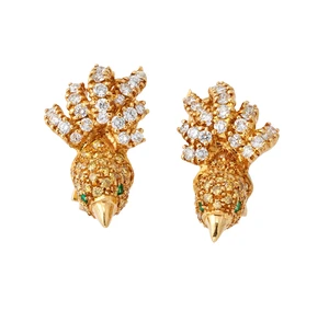 A pair of diamond set earclips, in the form of birds, with pav&eacute; brilliant-cut diamond tails,...