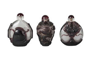 
	
		Three Chinese Peking glass cameo large snuff bottles, early 20th century, two of...