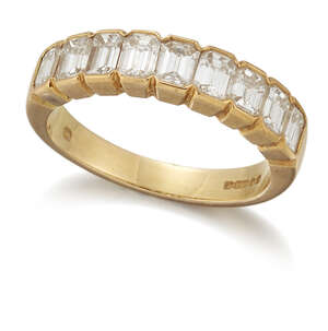 
	
		A baguette diamond half eternity ring, composed of a line of nine baguette-cut diamonds,...