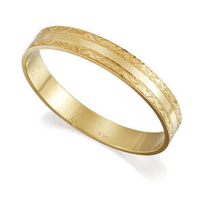 A hoop bangle, with scroll design borders, internal diam. 7.7cm