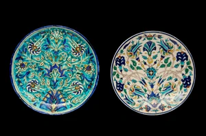 Two Kutahya rimless pottery dishes,&nbsp;Turkey, 20th century,&nbsp;
Each shallow, on short straight foot,...