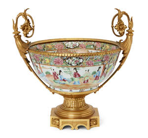A Chinese Canton porcelain punch bowl with ormolu mounts, 19th century, painted in famille rose...