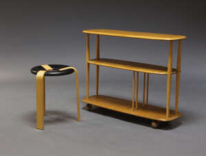 
	
		An Ercol elm three tier trolley, the rounded elm tiers on tapered beech supports, raised...