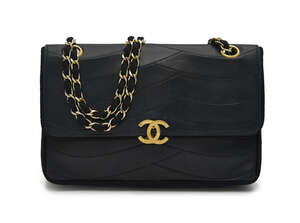 
	
		Chanel: a black leather box bag, with curved quilting, front flap and interlocking C gilt...
