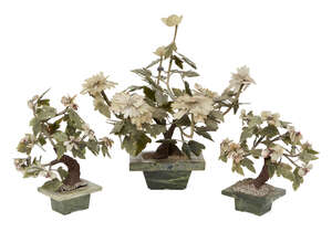 
	
		A garniture of three Chinese hardstone gem trees, early 20th century, each with...