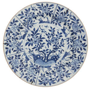 A Chinese export porcelain charger, 18th century, painted in underglaze blue with birds amid flowering branches, unmarked, 32cm diameter