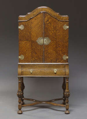 
	
		A 17th century style oak cocktail cabinet on stand, early 20th century, with pierced...