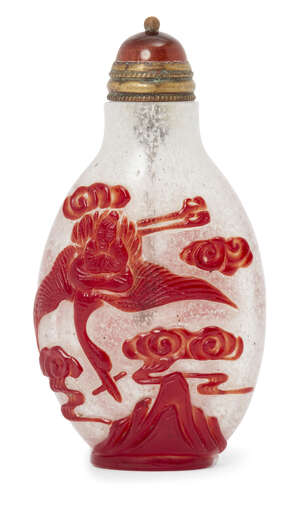 
	
		A Chinese cameo glass snuff bottle, 19th century, carved in red over clear glass with two...