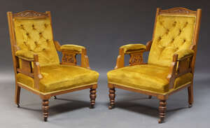 
	
		A pair of Edwardian walnut button back armchairs, the serpentine crest rail with carved...