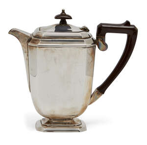A silver coffee pot, Birmingham, c.1962, the body of cuboid form raised on a cut-cornered rectangular foot, the angular synthetic handle to hinged lid topped w