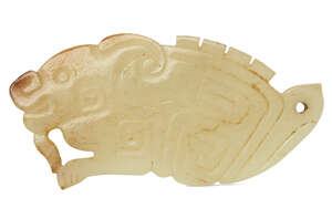 
	
		A rare Chinese yellow jade pendant, Western Zhou dynasty, carved as a stylised mythical...