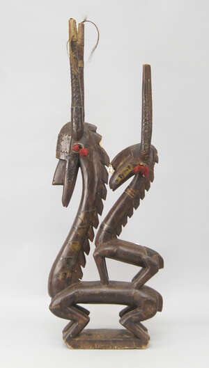 
	
		A tribal antelope sculpture, Bambara, modelled as a pair of antelope, a baby resting on...