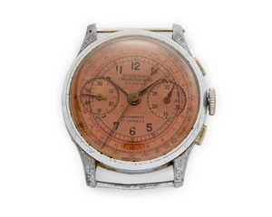 Swiss. A chrome plated chronograph watch with salmon dial signed Sideral/Chronographe SuisseCirca 1950Unsigned 17 jewel steel chronograph movement, salmon dial