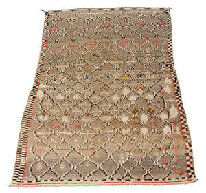 
	
		A Moroccan handwoven long pile wool rug
		Second quarter 20th century
		grey with red...