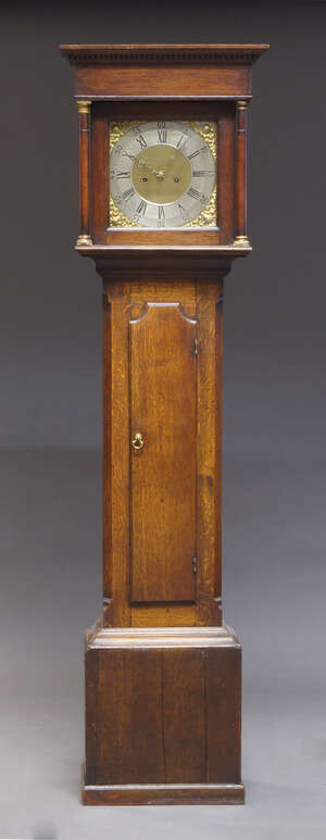 
	
		An oak longcase clock, late 18th, early 19th Century, with dentil moulded cornice above...