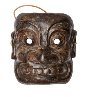 
	
		A Japanese mingei wood mask, Meiji period, carved as an Oni with wide eyes and teeth...