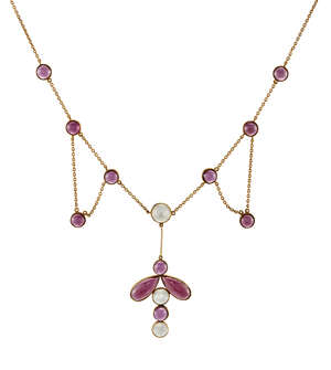 
	
		An Edwardian gold, garnet and moonstone festoon necklace, the fine belcher-link neckchain...