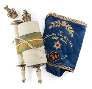 
	
		A miniature Sefer Torah mounted on ivory tipped rollers with gilt crown finials (one...