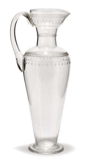 
	
		An Arts & Crafts engraved glass water jug  possibly made by James Powell & Sons 
		late...