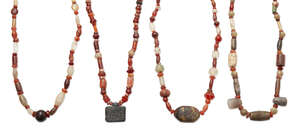 
	
		Four hardstone necklaces, comprised of ancient and modern beads, carnelian, amber, rock...