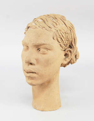 
	
		A terracotta portrait bust of a girl, 20th century, modelled with swept back hair, with a...