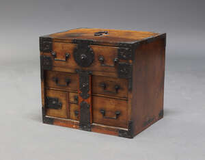 
	
		A Korean iron bound table top cabinet, the rectangular top with handle, above an...