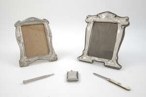 
	
		A silver photograph frame, Birmingham, c.1909, J.Aitken & Son, with wooden back and...