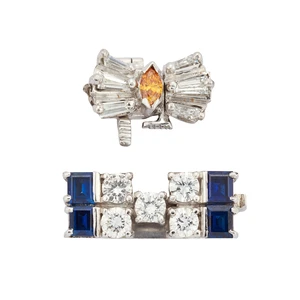 Two diamond and gem-set clasps, comprising: a tapered baguette-cut diamond and marquise-cut...