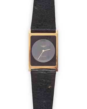 Longines. A slim cased 18ct gold quartz wristwatch Case number 19120389, Circa 1980Quartz movement, stepped black dial and gilt stick hands, brush finish rect
