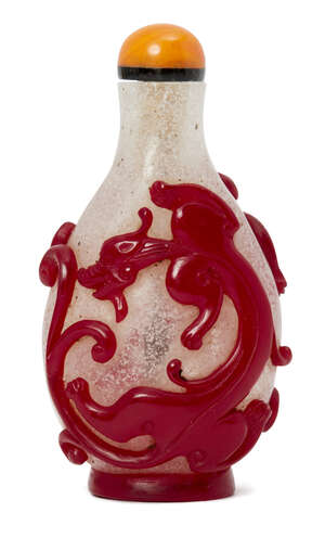 
	
		A Chinese glass overlay snuff bottle, 19th century, decorated in red over clear glass...