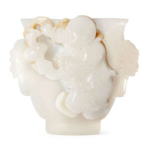 
	
		A Chinese agate cup, 18th/19th century, finely carved with a boy holding a bat, with lion...
