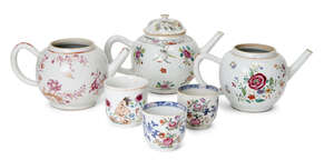 
	
		Three Chinese export porcelain teapots, 18th century, painted in famille rose enamels...