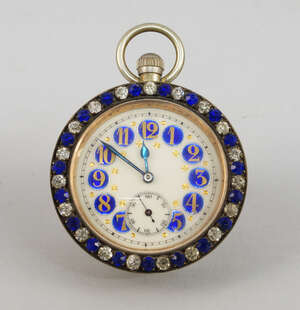 
	
		An early 20th century pocket watch style desk timepiece, blue enamel circles encompassing...
