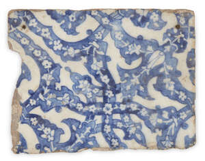 
	
		A blue and white pottery tile in the Iznik style, late 19th-early 20th century, of...
