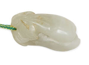 
	
		A Chinese pale green jade pendant, 19th century, carved as a leafy branch issuing two...